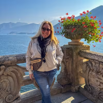 Traveler overlooking Lake Como from the terrace at Villa del Balbianello, Italy