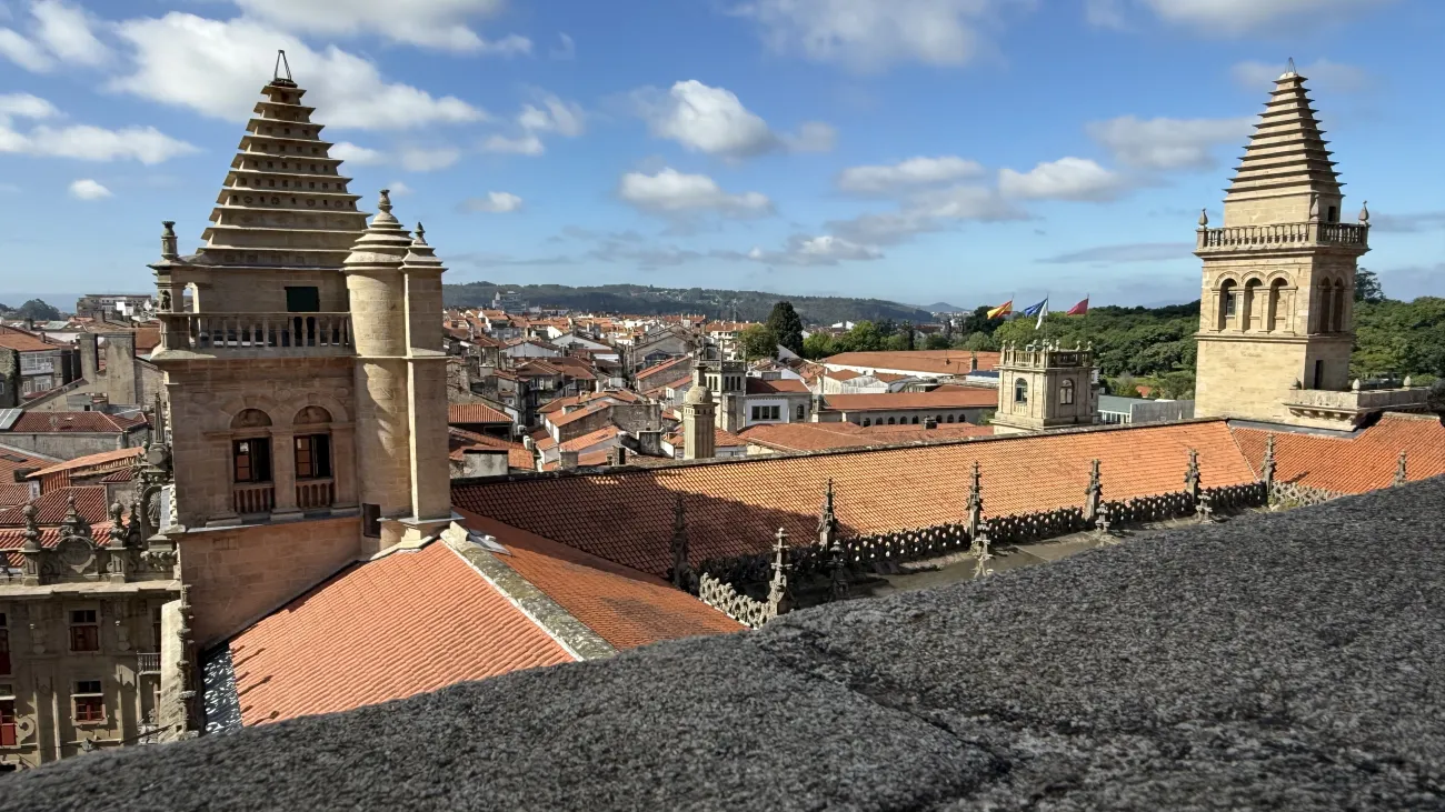 Rooftop view over Santiago de Compostela cathedral towers and red‑tiled old town